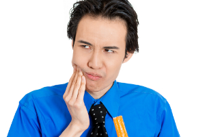 Young Man with Teeth Sensitivity