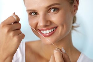 Woman Holding Floss